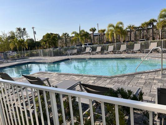 Pool area with hot tub showing top left corner.