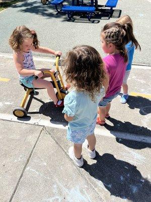 Halle playing with her friends and sharing