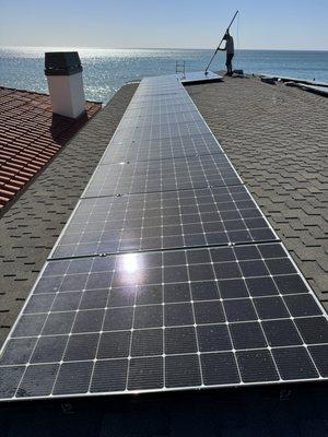 Cleaning solar panels in Capistrano Beach.