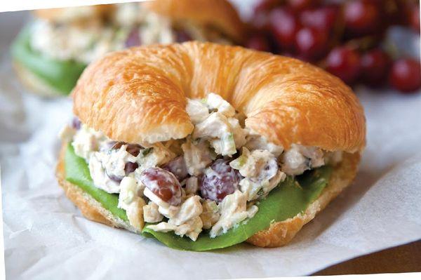 All white meat chicken salad with roasted almonds and cranberries on freshly baked croissant. We are on UBEREATS