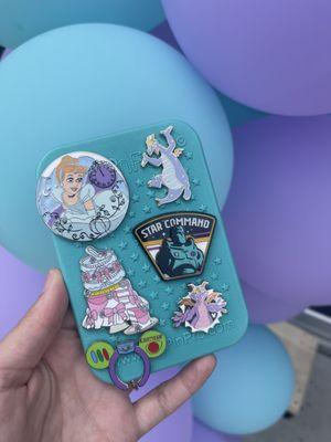 Cinderella, Figment, and Buzz Lightyear pins.