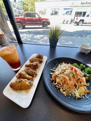 Thai tea, sticky wings, shrimp papaya salad