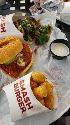 Scorchin' hot chicken sandwhich, smashed tots, brussel sprouts