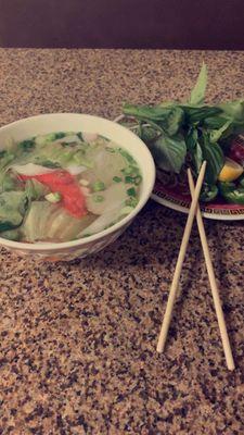 Pho rice noodle with shrimp, crab meat, squid, fish patty