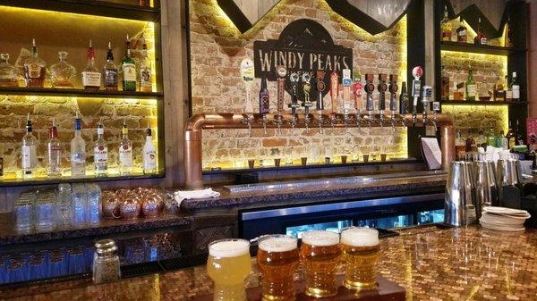 Love the exposed brick and the penny bar