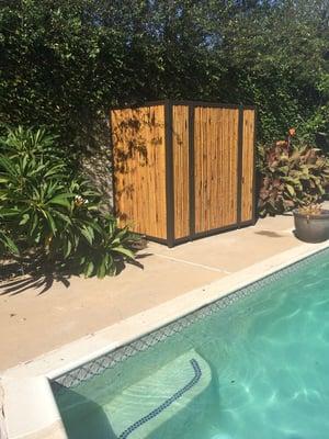 Bamboo fencing framed w iron around my pool equipment