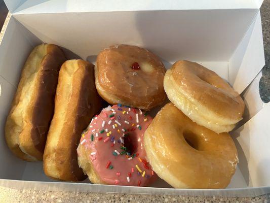 Half dozen (2 glazed, 2 chocolate long johns, strawberry sprinkled, and a jelly)