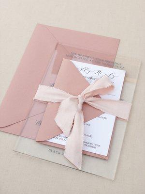 Clear acrylic invitation set with a suede ribbon