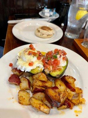 Avocado Benedict Breakfast with a side of English muffin