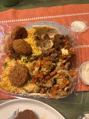 Picture taken after we dug in! Got the mixed grilled plate with rice, we also added an order of falafel- it normally comes with 2 falafel.