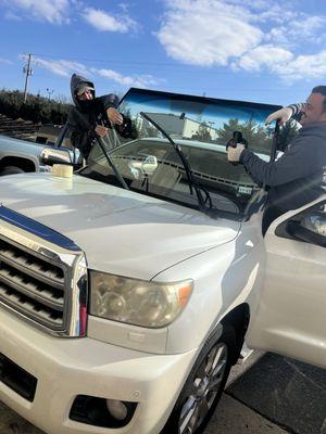 Our glass techs adding in   the new windshield