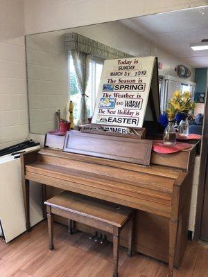 A volunteer comes by sometimes to play and sing for them.