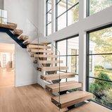 Floating mono stringer glass stair with wood tread