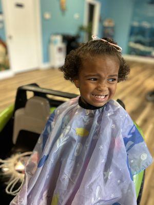 Say cheese. First hair cut.