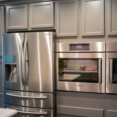 Craftsman style Gray cabinets with double wall ovens