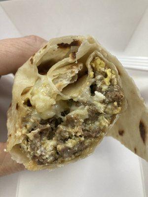 Protein bomb! Breakfast burrito with carne asada, eggs, and cheese in the BEST tortilla!