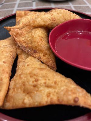 Fried wontons with cream cheese.