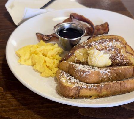 Classic French Toast w/ syrup on the side, scrambled eggs, and applewood bacon. Yum!