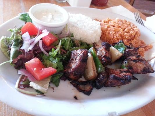 Lamb Shish Kebab (marinated lamb cubes charcoal grilled) served w/ house salad, rice pilaf and bulgur pilaf $14.95