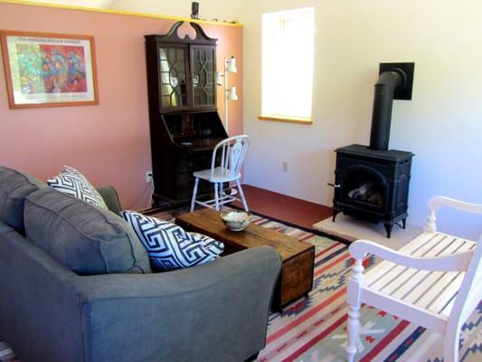 Plaza House's cozy living room. The gas stove is great for taking the chill off early spring and late fall nights.