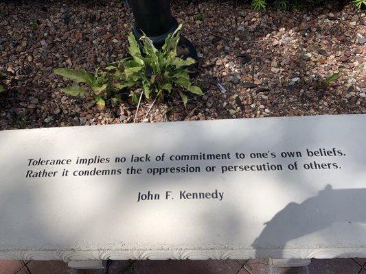 One of 14 hand carved stone benches with a quote in The Garden of Humanity designed by Yaacov Heller