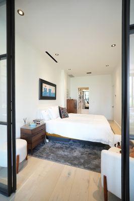 Glass door opening into the bedroom