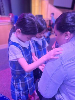 Students praying for others.