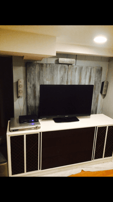 Basement Refinished-Entertainment Wall
 Hand distressed wall piece and furniture upcycle