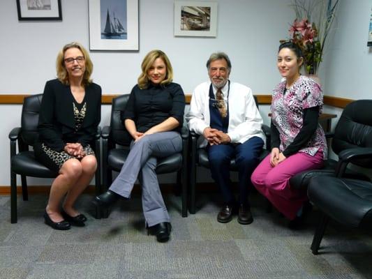 Office manager Daphne, assistant Viviana, Dr. Dave and assistant Clara take a moment to smile for the camera