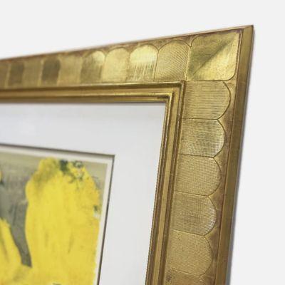 Detail of a carved gesso and 22k gold leaf finished corner frame.