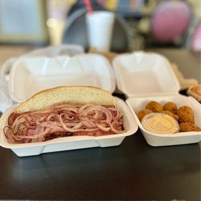 Pastrami sandwich and hush puppies