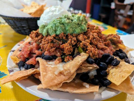 Nachos. $8.75. Black beans, guacamole (+$3.75), housemade corn and flour chips, Monterey Jack cheese, sour cream, jalapenos, salsa fresca.