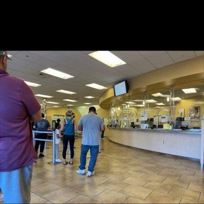 12 in line, 2 tellers on a Friday, and they are closed Monday. 20 minutes to reach a teller.