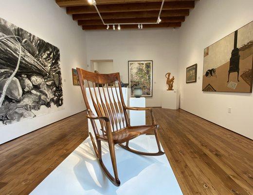 CLMA gallery during the Claremont Collects exhibition featuring a rocking chair by Sam Maloof.