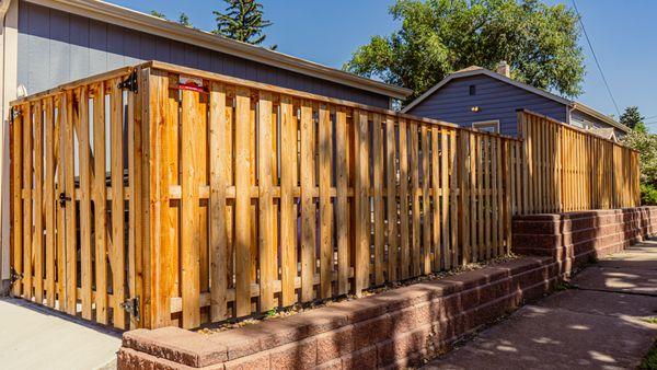 Here is a vertical shadow box fence with a top cap recently built!