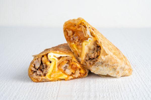 Bruxie Breakfast Burrito. Egg, Chipotle Mayo, Seasoned Tots Bruxie Cheese Sauce, Cheddar and your Choice of Protein.