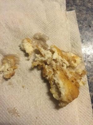 Took a bite in my nugget and this is what I find, a hair cooked with the nugget, the person on duty stated he needs to see proof