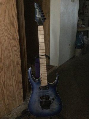 Ibanez RGAR42MFMT mahogany body, maple neck and fingerboard, downward facing tuners, locking nut tremolo, flat blue lagoon.