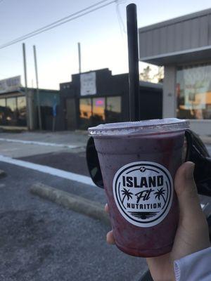 Blueberry cheesecake smoothie with the location of the shop in the background!