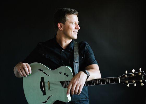 Recording artist with his Taylor guitar.