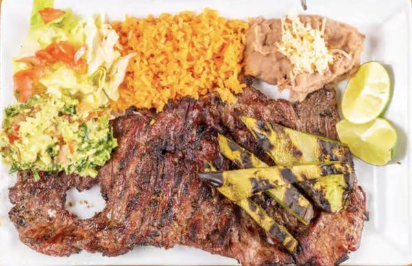 El PISTOLERO Steak Dinner: The gunslinger plate fuels your mission with a hearty carne asada [steak] so good, fingers will be licked.