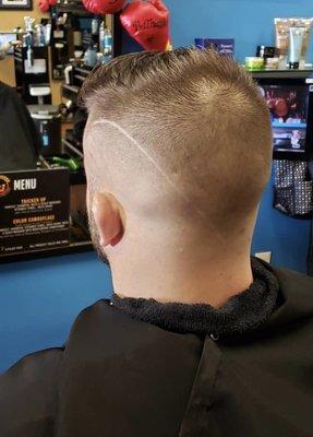 Fade haircut with line design