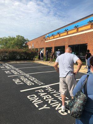 A very long line for DMV office.