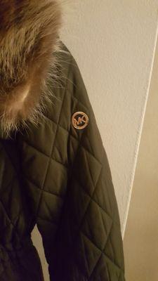 This coat brand is Michael Kors not Calvin Klein.