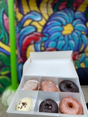 French Toast Brioche, Apple Fritter, Chocolate Glazed Brioche, Passionfruit Chocolate Cake, Double Chocolate + Sea Salt, and Raised Glazed