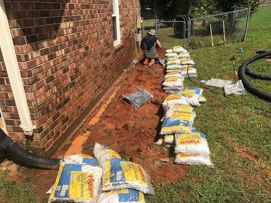 Pressure wash footer and wall