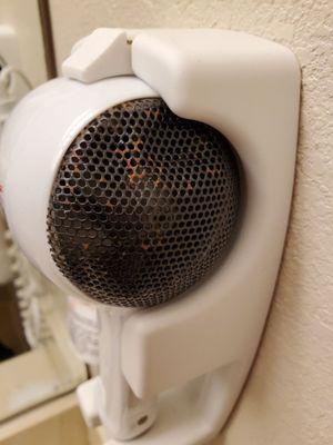 Rusty and dented hair dryer