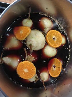 Poached pears in burgundy wine and tangerines.