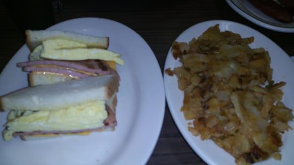 pork roll egg and cheese on white and home fries.