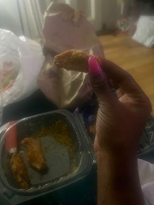 My hand look mad huge next to this wing